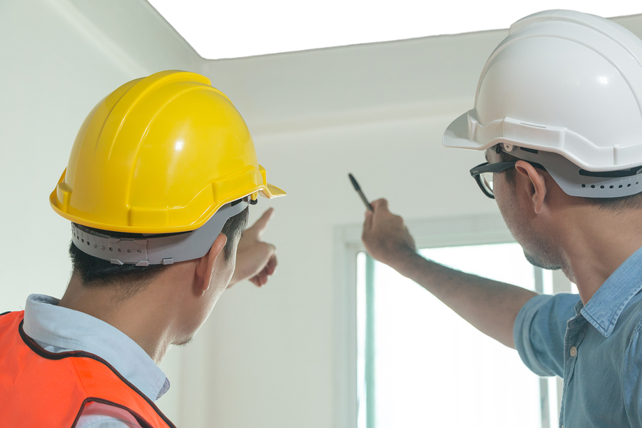 Architects And Engineers Examine The Interior Of The Home To Cre Architects and engineers examine the interior of the home to create a successful building plan before delivering quality housing to the customer.