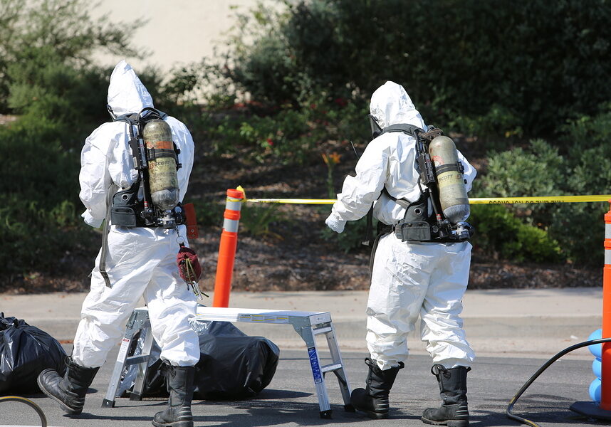 Lake Forest, California, May 23, 2017: Hazardous materials team, cleans up a single truck accident containing swimming pool chemicals, preventing poisonous liquids from release into the environment.